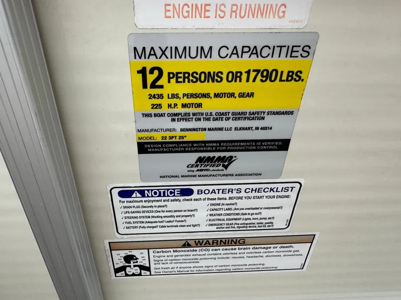 Slide: The Image of Sign showing maximum capacity: 12 persons or 1790 lbs. Includes safety and warning notices. - 21