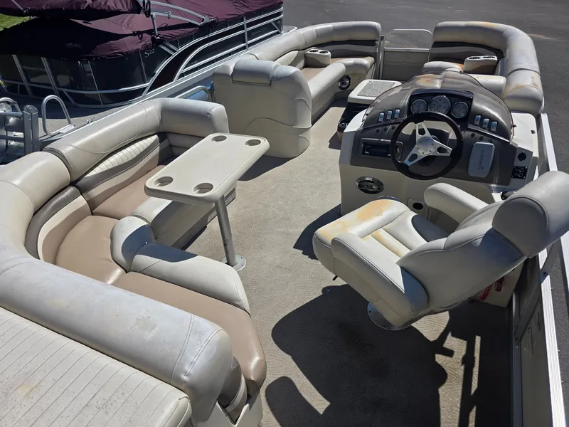 Slide: The Image of The image shows the cockpit of a 2008 Bennington 2275RL SPS TRI with beige and white seating. - 17