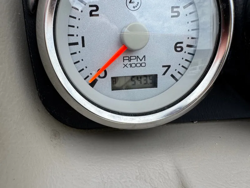 Slide: The Image of A tachometer displays 543.9 RPM. It is installed in a boat. - 20