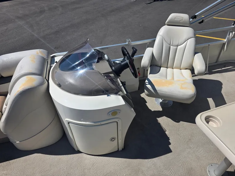 Slide: The Image of The image shows the cockpit of a 2008 Bennington 2275RL SPS TRI with a helm and two seats. - 15
