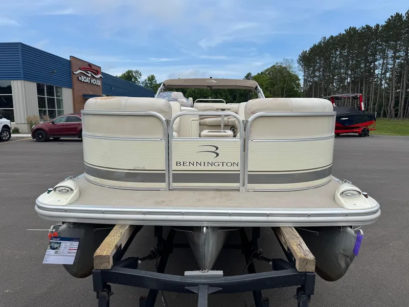 Slide: The Image of A 2008 Bennington 2275RL SPS TRI pontoon boat on a trailer in front of a building. - 9