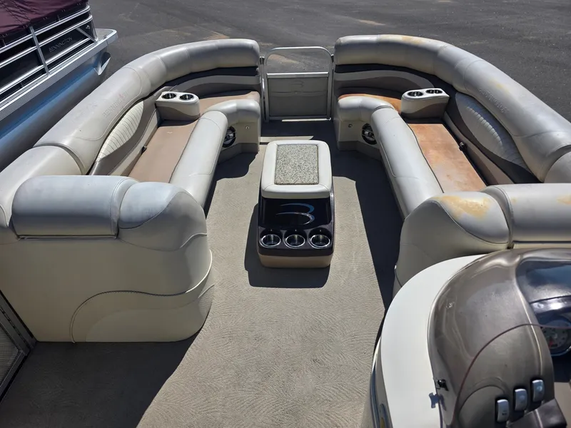 Slide: The Image of Interior of a 2008 Bennington 2275RL SPS TRI with cushioned seating and cup holders. - 19