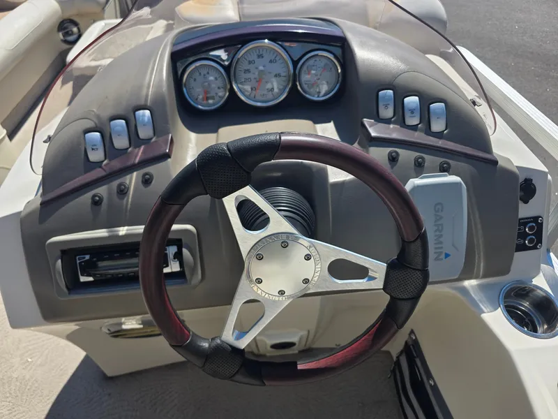 Slide: The Image of The image shows the dashboard of a 2008 Bennington 2275RL SPS TRI with a Garmin device. - 16