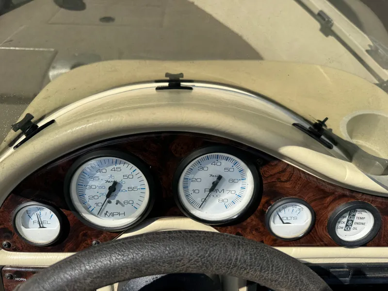 Slide: The Image of Dashboard of a boat with speedometer and fuel gauge. - 21