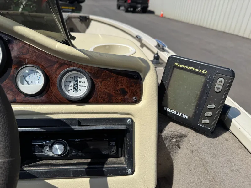 Slide: The Image of Close-up of a boat's dashboard with instruments and a fish finder. - 22