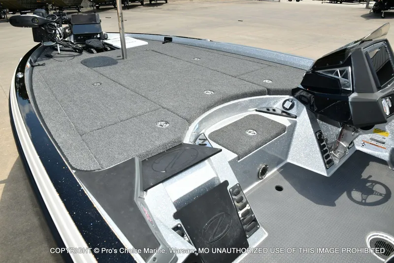 Slide: The Image of The image shows the deck of a 2021 Ranger Z521L CUP boat with gray carpeting. - 21