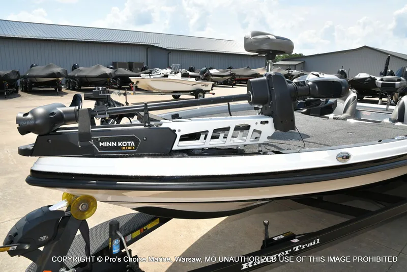 Slide: The Image of A 2021 Ranger Z521L CUP boat on a trailer in a storage area. - 36