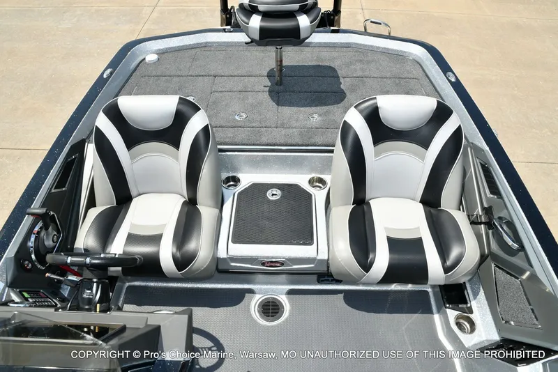 Slide: The Image of The image shows the cockpit of a 2021 Ranger Z521L CUP boat with two padded seats. - 18