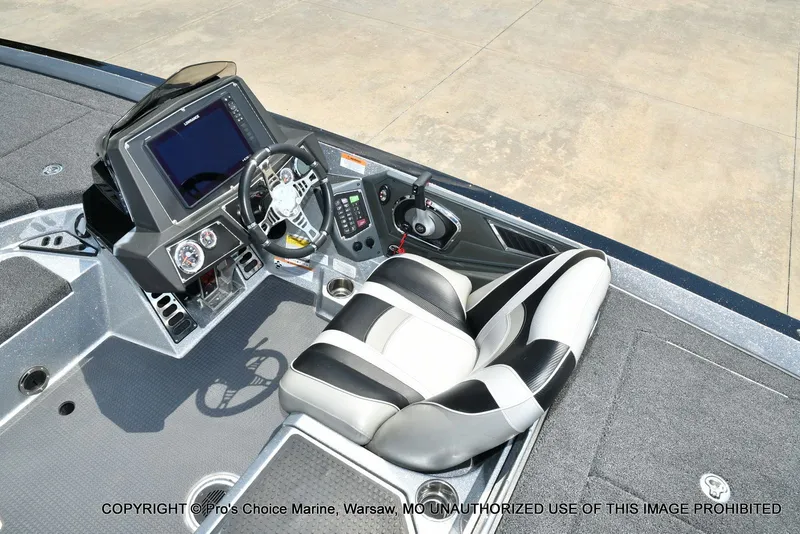Slide: The Image of The image shows the cockpit of a 2021 Ranger Z521L CUP boat with a modern helm. - 49