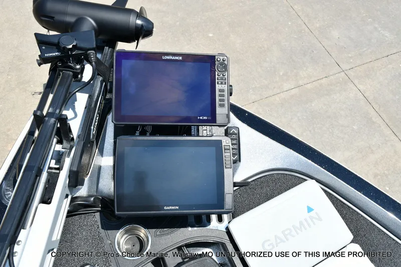Slide: The Image of Two navigation screens on a boat, surrounded by equipment and a Garmin device. - 16