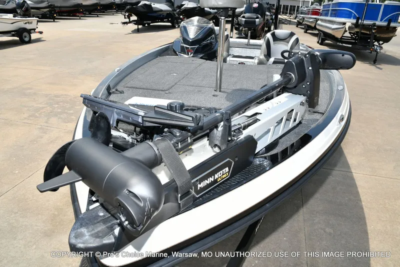 Slide: The Image of A 2021 Ranger Z521L CUP boat with a Minn Kota trolling motor on a parking lot. - 19