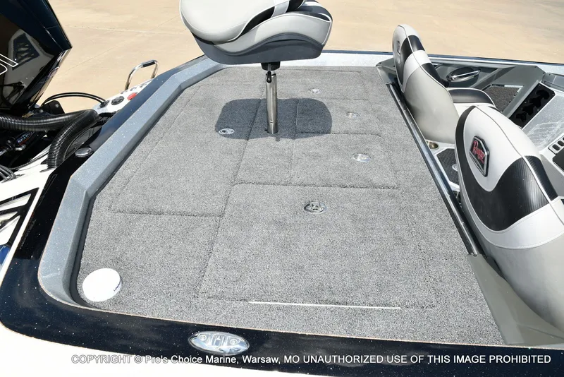 Slide: The Image of The image shows the deck of a 2021 Ranger Z521L CUP boat with gray carpeting. - 43