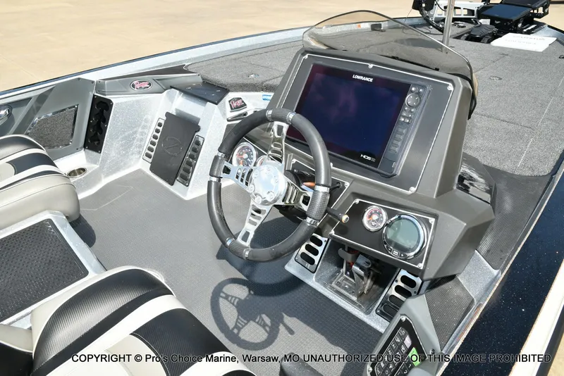 Slide: The Image of Interior view of a modern boat cockpit with steering wheel and electronic displays. - 8