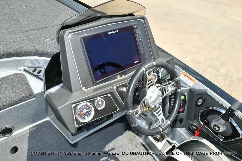 Slide: The Image of The image shows the cockpit of a Ranger Z521L CUP boat with a large screen and controls. - 50
