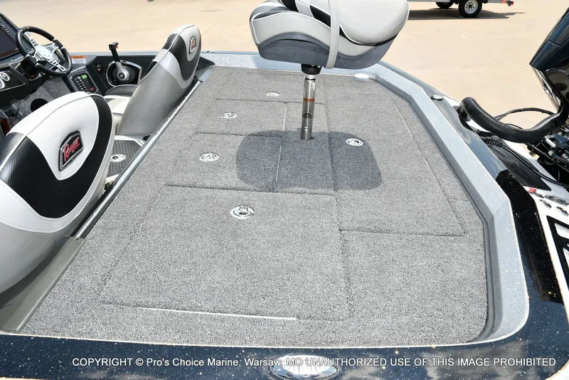 Slide: The Image of The image shows the deck of a 2021 Ranger Z521L CUP boat with gray carpeting. - 46