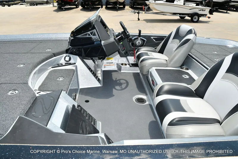 Slide: The Image of The image shows the cockpit of a 2021 Ranger Z521L CUP boat with modern seating and controls. - 22