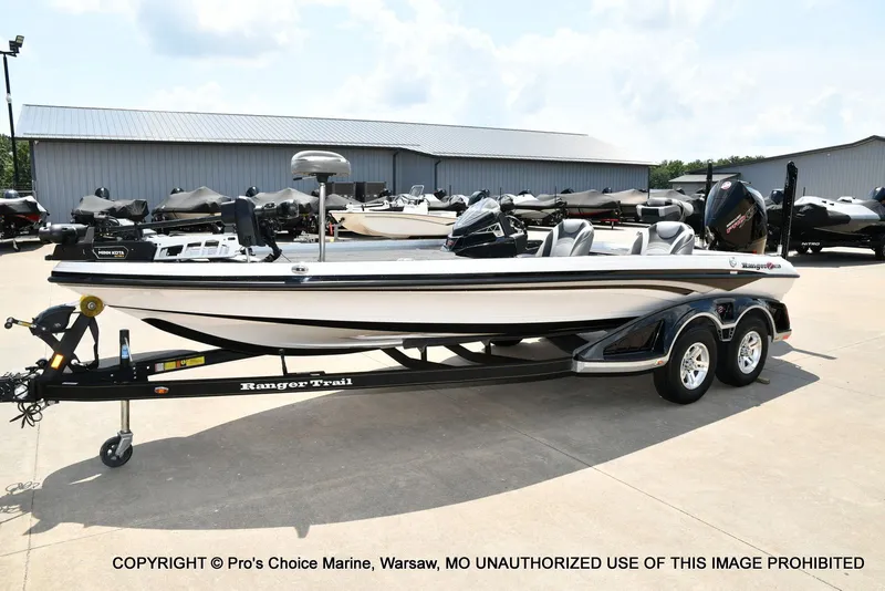 Slide: The Image of A 2021 Ranger Z521L CUP boat on a trailer in a parking lot. - 34