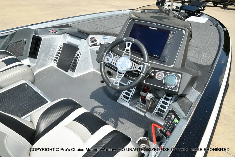 Slide: The Image of The image shows the cockpit of a 2021 Ranger Z521L CUP boat with modern instruments. - 44