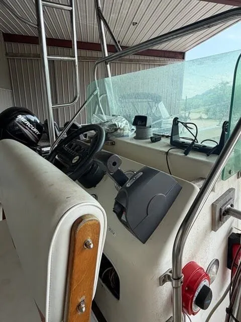 Slide: The Image of The image shows the cockpit of a 1974 Aquasport WT20 with steering wheel and instruments. - 8