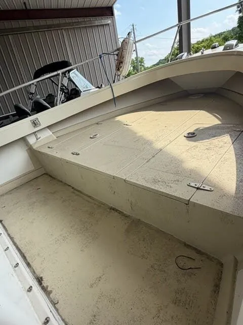 Slide: The Image of The image shows the deck of a 1974 Aquasport WT20 boat in a covered area. - 9
