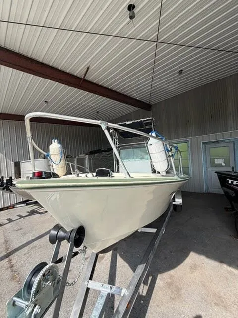 Slide: The Image of 1974 Aquasport WT20 on a trailer inside a warehouse. - 2