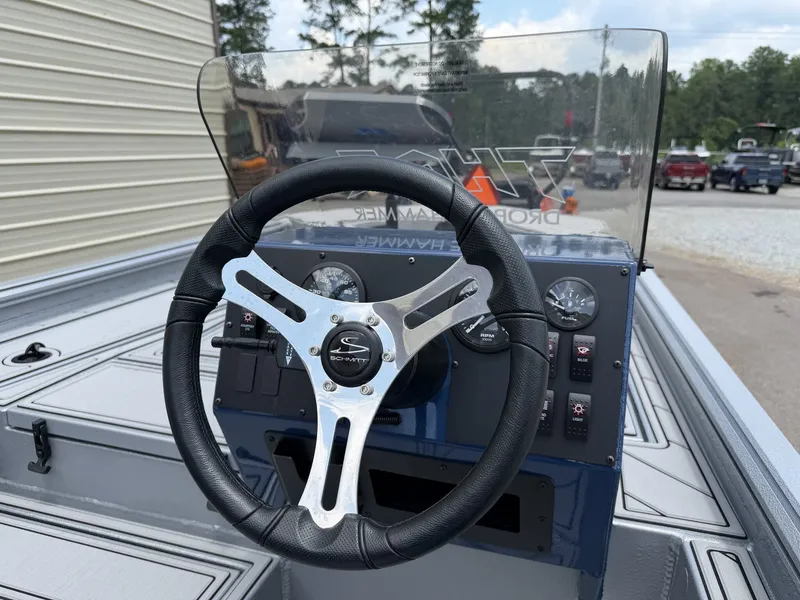 Slide: The Image of The image shows the helm of a Thor Lake Hammer 1900 SC 115HP SS boat. - 7