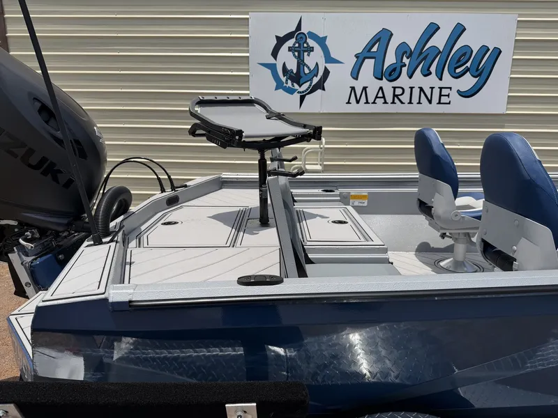 Slide: The Image of The image shows a blue boat with two seats and a motor, positioned on land. - 8