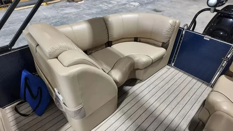 Slide: The Image of The image shows a beige leather seating area on a boat with a wooden floor. - 50