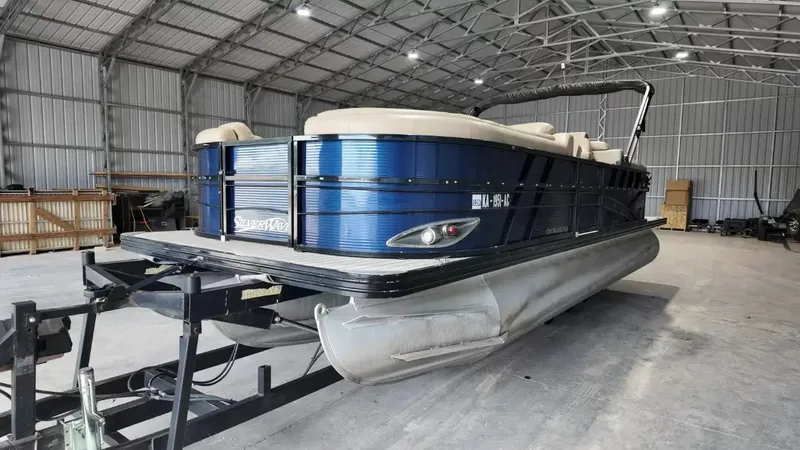 Slide: The Image of A 2019 Silver Wave 230 Island CLS pontoon boat in a storage facility. - 14