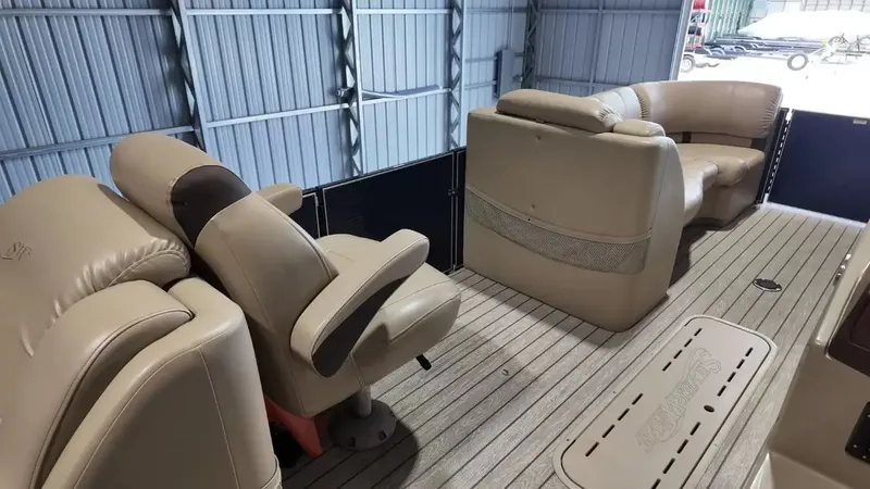 Slide: The Image of The image shows the interior of a 2019 Silver Wave 230 Island CLS with beige leather seating. - 48