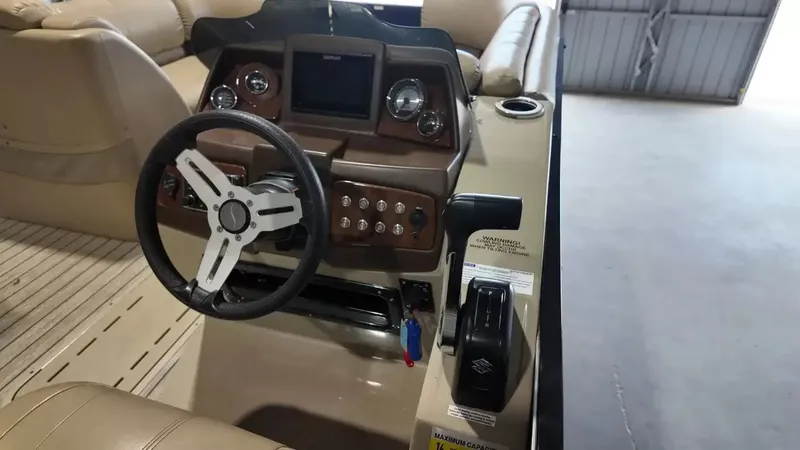 Slide: The Image of The image shows the cockpit of a 2019 Silver Wave 230 Island CLS with a modern helm. - 45