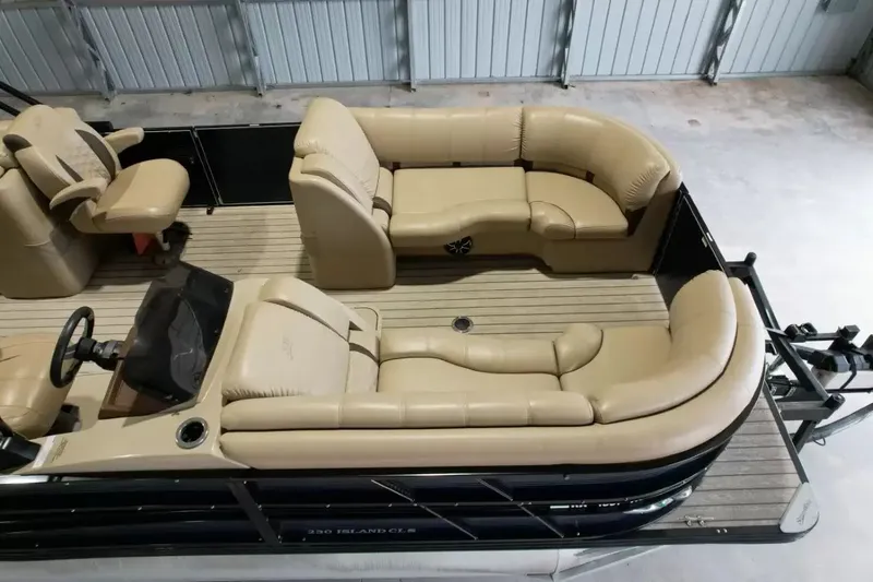 Slide: The Image of The image shows the interior of a 2019 Silver Wave 230 Island CLS with beige leather seating. - 33