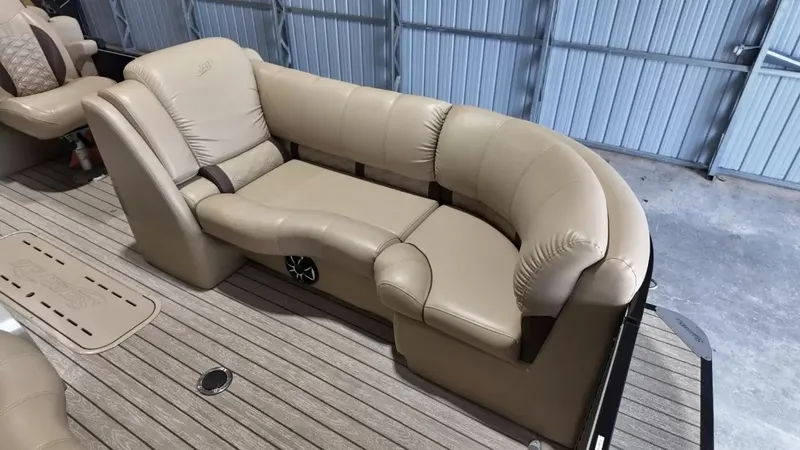Slide: The Image of The image shows a beige leather seating area on a boat with a wooden floor. - 31