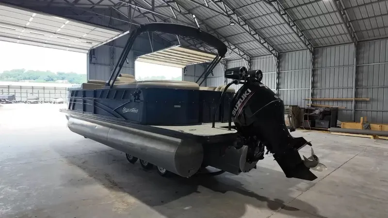 Slide: The Image of A 2019 Silver Wave 230 Island CLS pontoon boat is parked in a large warehouse. - 13
