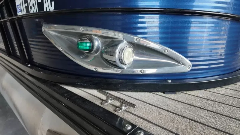 Slide: The Image of Close-up of a boat light on a blue boat hull. - 17