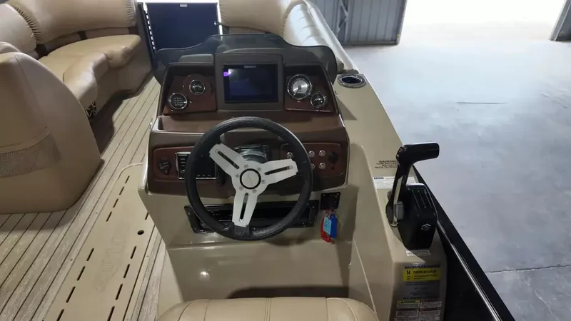 Slide: The Image of The image shows the cockpit of a 2019 Silver Wave 230 Island CLS with a modern helm. - 42