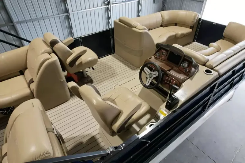 Slide: The Image of The image shows the interior of a 2019 Silver Wave 230 Island CLS with beige seating and a modern helm. - 46