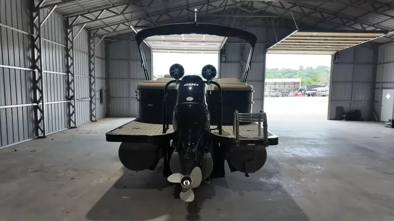 Slide: The Image of A 2019 Silver Wave 230 Island CLS is parked in a covered storage area. - 11