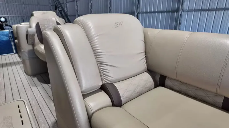 Slide: The Image of The interior of the 2019 Silver Wave 230 Island CLS features luxurious beige upholstered seating. - 23