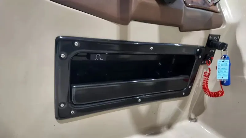 Slide: The Image of Close-up of a black storage compartment on a 2019 Silver Wave 230 Island CLS. - 44