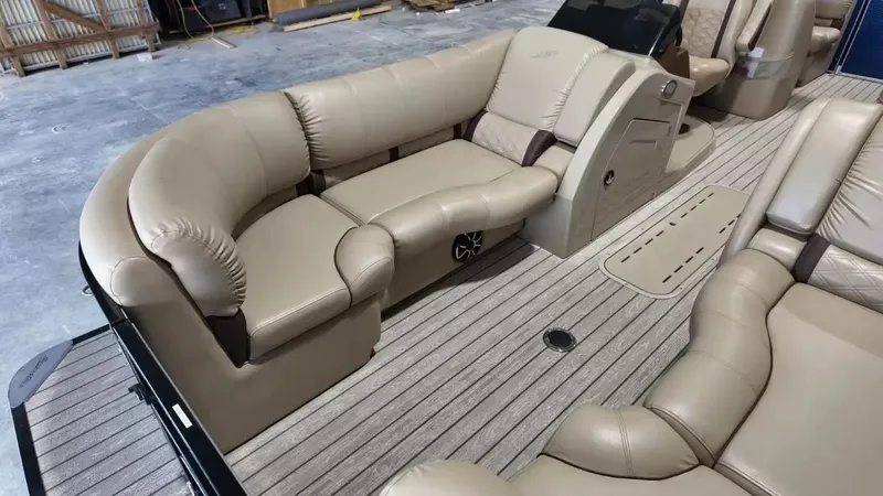 Slide: The Image of Interior of a 2019 Silver Wave 230 Island CLS with beige leather seating. - 25