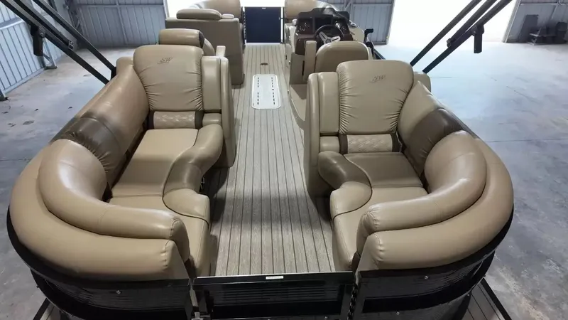 Slide: The Image of The image shows the interior of a 2019 Silver Wave 230 Island CLS with beige leather seating. - 49