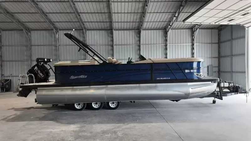 The Image of A 2019 Silver Wave 230 Island CLS pontoon boat is parked in a warehouse. - 1