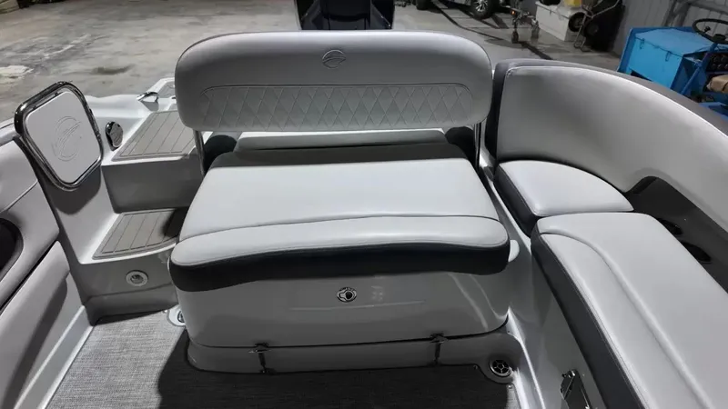 Slide: The Image of 2021 Crownline Eclipse E215 XS with sleek gray upholstery and spacious seating area. - 42