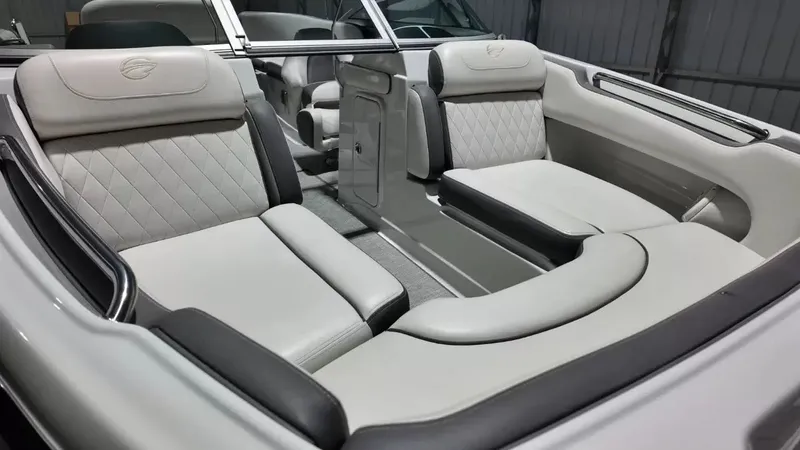 Slide: The Image of The image shows the interior of a 2021 Crownline Eclipse E215 XS with sleek, upholstered seating. - 23