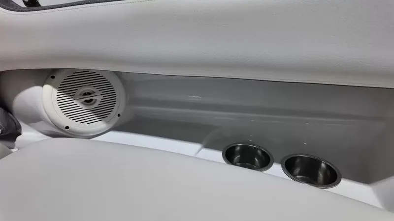 Slide: The Image of The image shows part of a boat's interior with a speaker and two cup holders. - 22