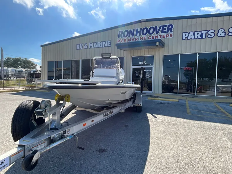 Slide: The Image of Majek 20 Xtreme 2025 on a trailer outside a marine center. - 2
