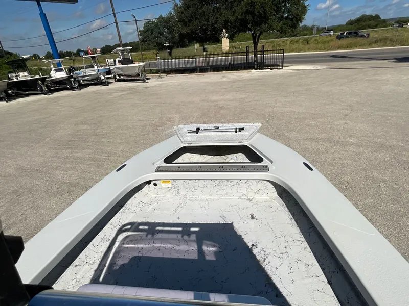 Slide: The Image of Bow of a Majek 20 Xtreme boat on a parking lot. - 13