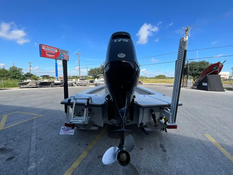 Slide: The Image of The image shows a 2025 Majek 20 Xtreme boat with an outboard motor, parked in a lot. - 5
