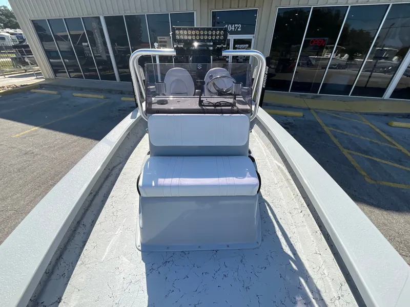 Slide: The Image of Majek 20 Xtreme 2025 on a parking lot in front of a building. - 12